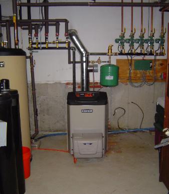 Weil Mclain oil boiler installed with a Weil Mclain indirect hot water heater installed in Somerville, MA.