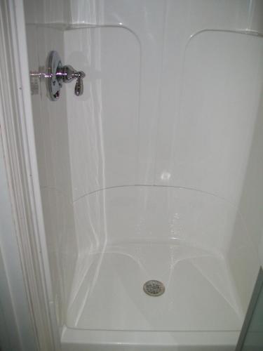 Symmons shower valve installed in a Lasco shower enclosure in Burlington, MA