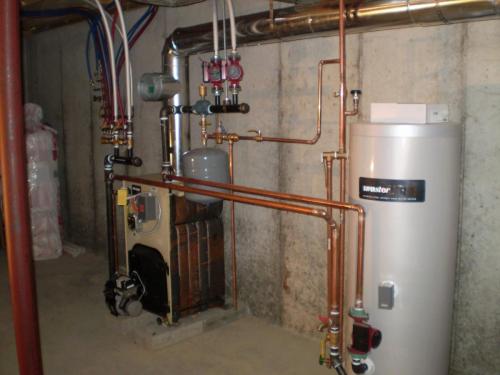 Weil Mclain oil hot water boiler installed with a 45 gallon Superstor in Medford, MA.