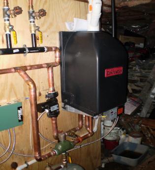 Munchkin 95% efficient wall hung boiler installed in Somerville, MA.