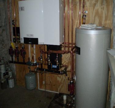 Buderus GB142 95% efficient wall hung boiler installed in Woburn, MA.  