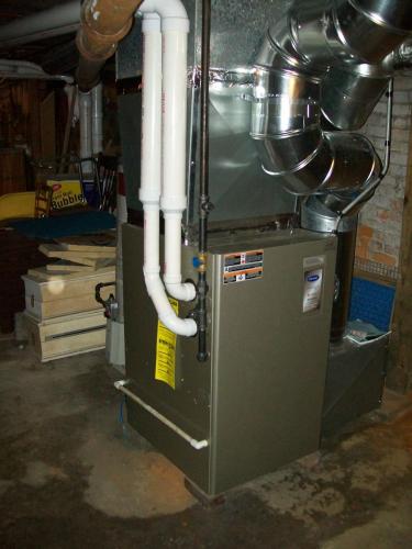 Carrier 95% efficient furnace installed in Cambridge, MA.  This furnace was eligible for a 0% MassSave Heat Loan