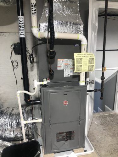Rheem 95% efficient natural gas furnace with a 3 ton Rheem air conditioning coil installed in Revere, MA