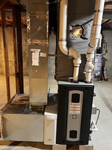 Trane 96.5% efficient natural gas heating furnace installed with 3.5 ton air conditioning coil 