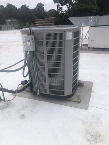 Carrier air conditioning condenser installed on roof